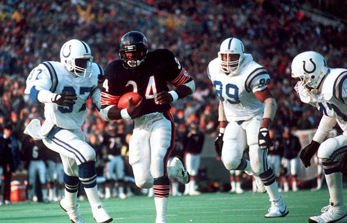 Former Chicago Bears running back Walter Payton runs with the football.