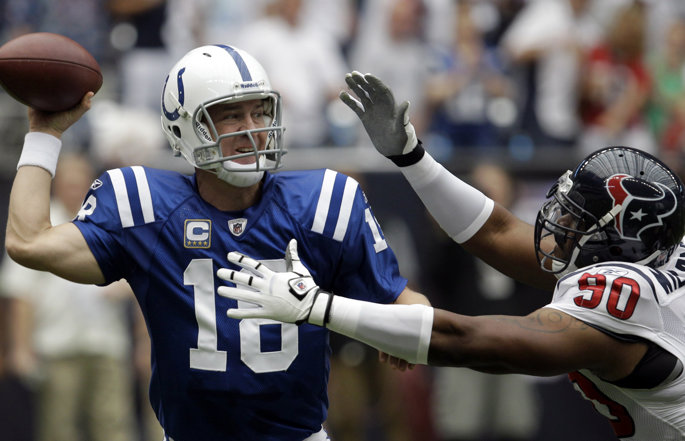 Former Indianapolis Colts quarterback Peyton Manning passes the football.