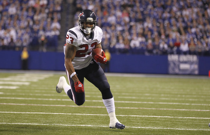 Former Houston Texans running back Arian Foster runs with the football.