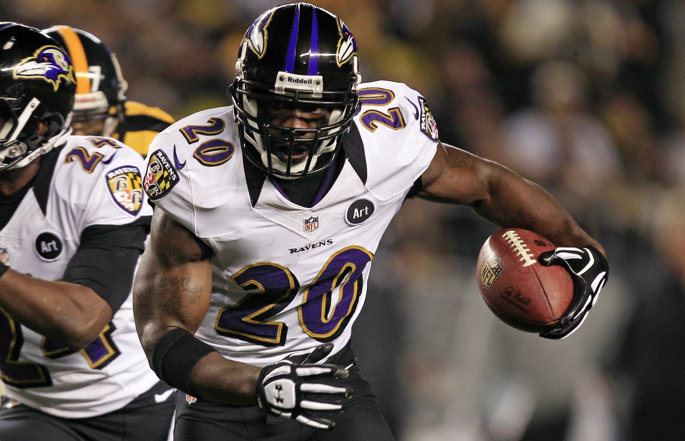 Former Baltimore Ravens safety Ed Reed runs with the football.
