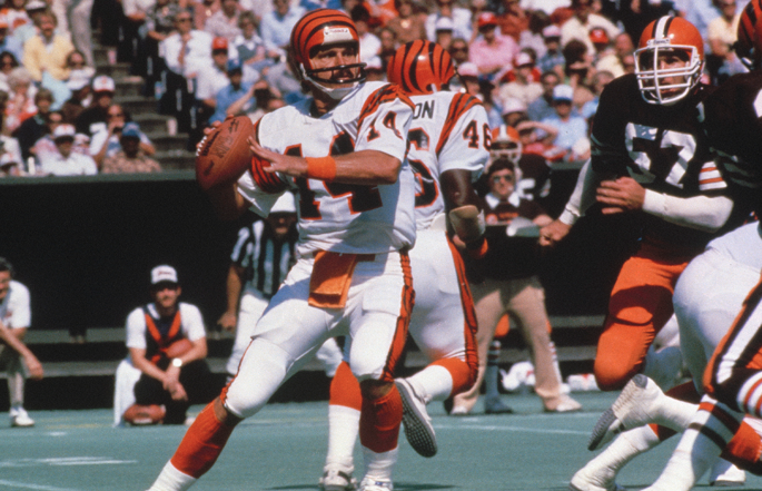 Former Cincinnati Bengals quarterback Ken Anderson passes the football.