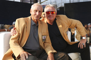Pro Football Hall of Fame placekickers Jan Stenerud and Morten Andersen pose together.