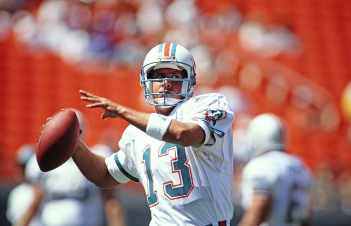 Former Miami Dolphins quarterback Dan Marino passes the football.