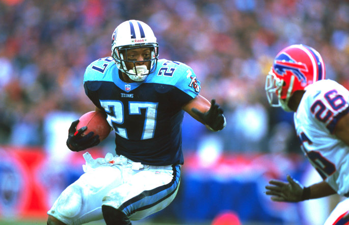 Former Tennessee Titans running back Eddie George runs with the football.