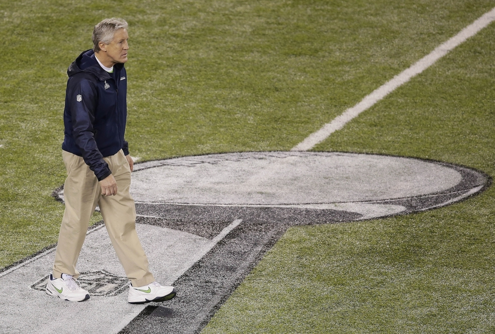 Seattle Seahawks head coach Pete Carroll walks on the field before&#xA0;Super Bowl XLVIII&#xA0;against the Denver Broncos. Hard work and a break from Mother Nature helped Game Operations staff get the&#xA0;MetLife Stadium&#xA0;field ready for the game.&#xA0; (AP Photo/Charlie Riedel)