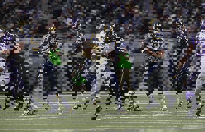 Former Los Angeles Rams running back Steven Jackson runs with the football.